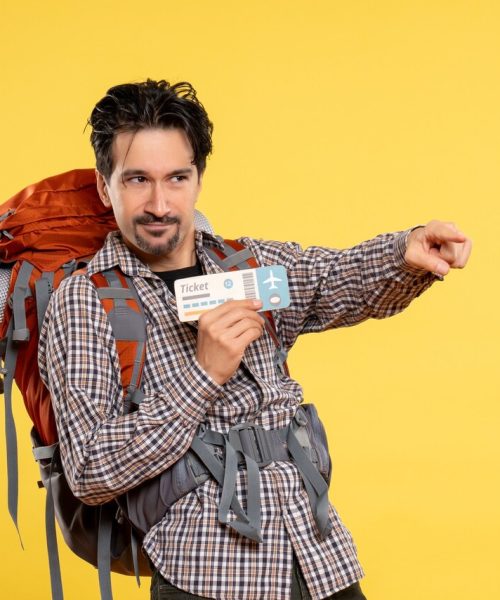 front-view-young-male-with-backpack-holding-ticket-yellow